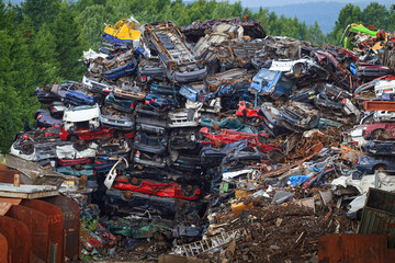 old car dump (big pile of cars)