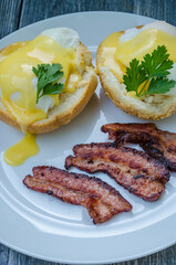 Homemade Benedict Eggs on the plate with souce