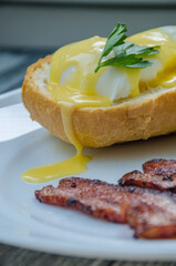 Homemade Benedict Eggs on the plate with souce