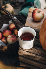 Fall styled composition. Autumn breakfast still life. Scandinavian hygge concept. Morning concept. Cozy autumn scene with pumpkins and apples. Flat lay. Home decor. Thanksgiving and Halloween concept.