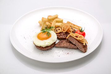 Beef rissole, juicy beef steak with egg and potatoes