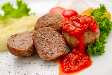 Veal meatballs with rice and tomato sauce