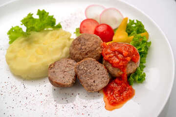 Veal meatballs with rice and tomato sauce