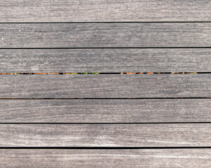 natural greyed wood dock planks top view closeup, textured pattern background