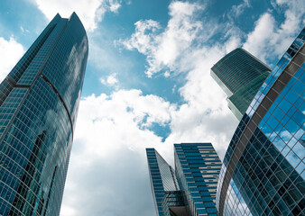 Fototapeta na wymiar Skyscrapers in a finance district, urban city architecture, sky cloudy background.