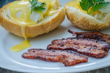 Homemade Benedict Eggs on the plate with souce