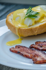 Homemade Benedict Eggs on the plate with souce