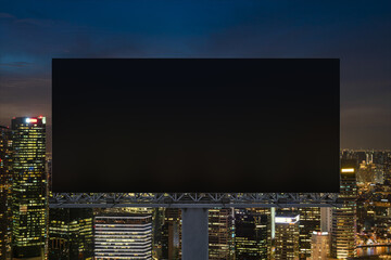 Blank black road billboard with Singapore cityscape background at night time. Street advertising poster, mock up, 3D rendering. Front view. The concept of marketing communication to sell idea.