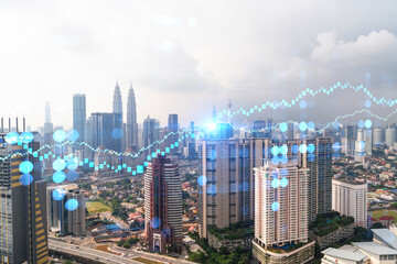 Fototapeta na wymiar Forex and stock market chart hologram over panorama city view of Kuala Lumpur. KL is the financial center in Malaysia, Asia. The concept of international trading. Double exposure.