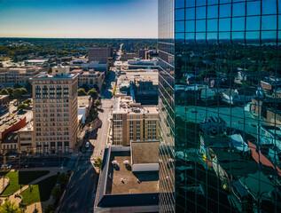 Aerial view of downtown Lexington, Kentucky partially blocked by blue glass reflective surface of...