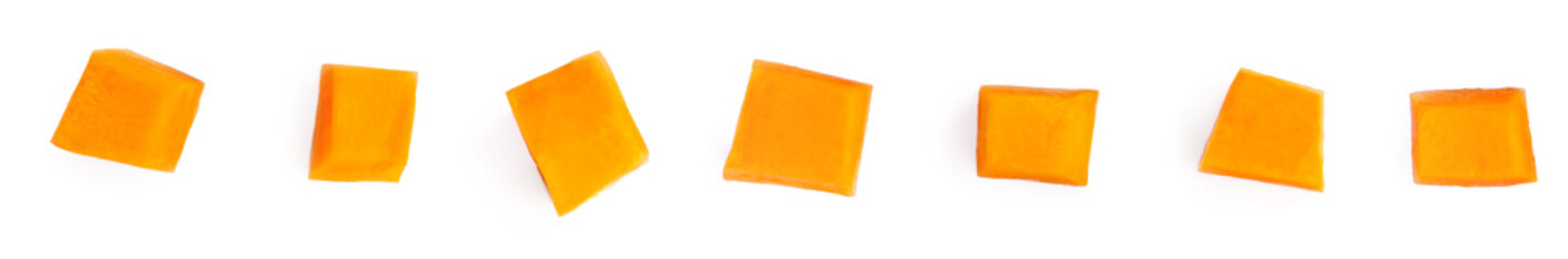 Pumpkin pieces cut in a cube slices  isolated on white background. Pumpkins chunks in a row