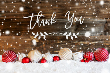English Calligraphy Thank You On Rustic Brown Wooden Backgroud. Red And White Festive Christmas...