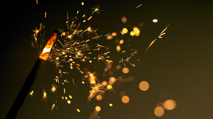 festive burning sparkler macro photo multicolor bokeh