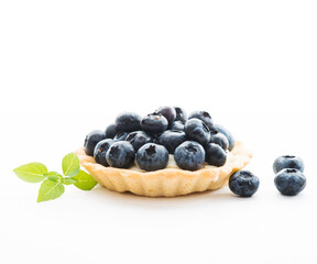 Mini tart with blueberries isolated on a white background