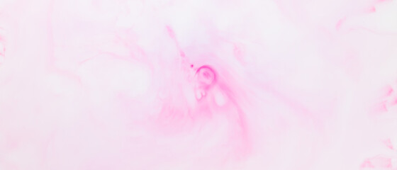 Fluid art texture. White pink background from liquid. Photography of colored spots on liquid. Abstract pattern for design