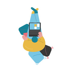 Top view of man sitting at home and working on laptop online