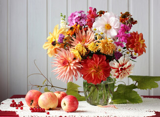 bouquet of garden flowers, apples and viburnum.