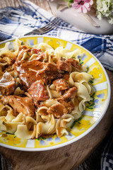 Pork stew served with noodles.