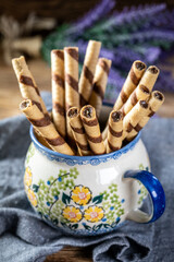 Sweet spiral tubes with nuts cream.