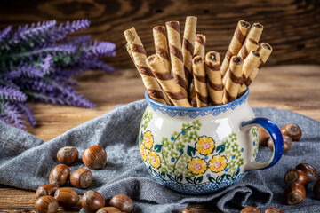 Sweet spiral tubes with nuts cream.