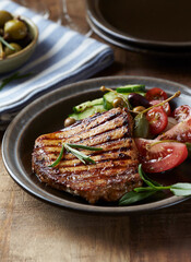 Grilled Turkey Breast with fresh salad. Close up.	