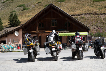 A group of bikers stops for a break in the Alps in France