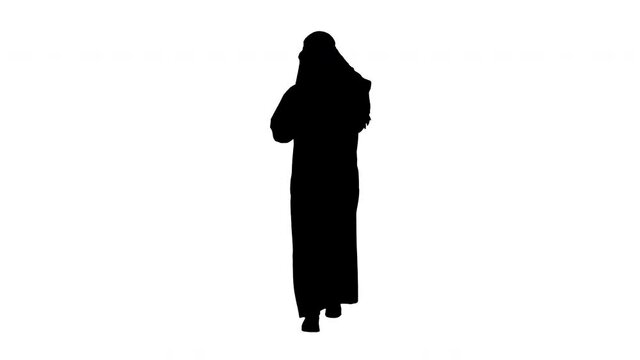 Arab sheikh wearing keffiyeh receiving grate news on the phone, Alpha Channel