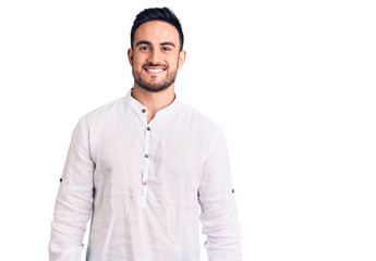 Young handsome man wearing casual clothes looking positive and happy standing and smiling with a confident smile showing teeth