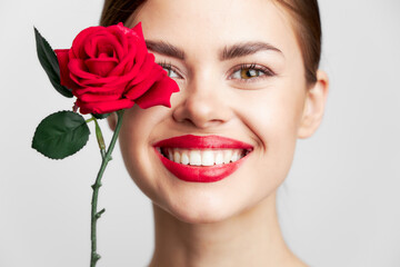 Woman with long hair Smile rose close-up clear skin 