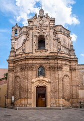 Fototapeta na wymiar Façade of the Church of Saint Joseph, built in the 18th century in Baroque style with the local Leccese sandstone (