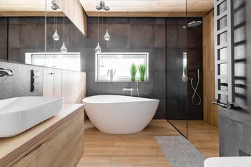 Stylish bathroom with wooden and concrete walls and white bath - obrazy, fototapety, plakaty