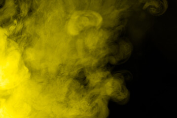 Fototapeta premium Yellow steam on a black background.