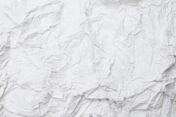 Crumpled white paper background.