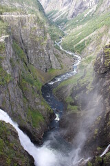 river flowing between high mountains - Vøringsfossen