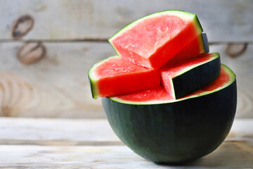Melon and watermelon slices on a wooden surface. Selective focus. Macro.