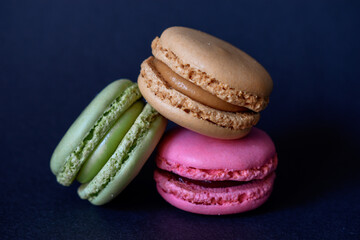 colorful macaroons on a black background 