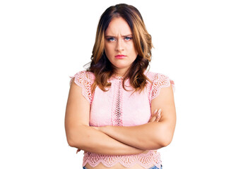 Young beautiful caucasian woman wearing casual clothes skeptic and nervous, disapproving expression on face with crossed arms. negative person.