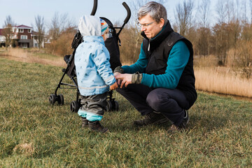 Mature man with toddler girl on dyke