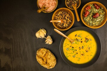 Pumpkin soup with fresh autumn hokkaido pumpkins.  Healthy food. Homemade preparation of pumpkin soup.