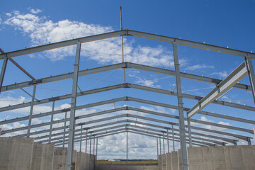Steel frame of a building under construction. The construction of the building is made of steel beams. Construction of prefabricated structures