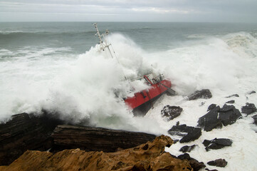 Fototapeta na wymiar part of cargo ship stranded on rocks