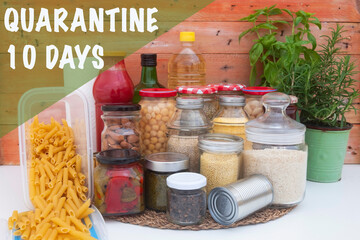 Covid-19 coronavirus infection. Small pantry of food for the period of isolation in quarantine. Several glass jars with cereals, legumes, jams, pasta and rice, canned cans