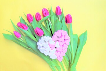 Valentine's day concept. bouquet of flowers, pink tulips. Marshmallow hearts.