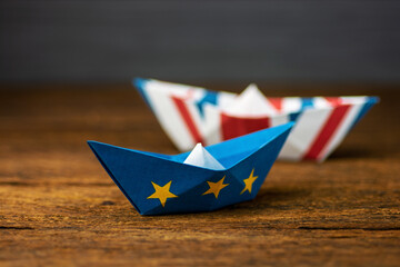  paper ships with European Union and Great Britain flags. Europe and UK - international relations...