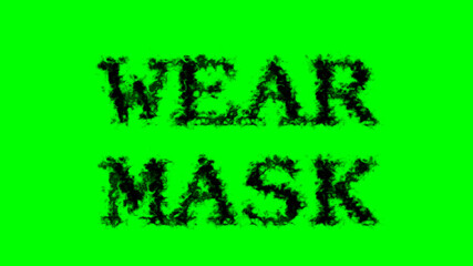 Wear Mask smoke text effect green isolated background. animated text effect with high visual impact. letter and text effect. 