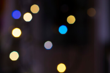 Obraz premium Christmas, New Year, holiday blurred background from lights garlands in the evening.