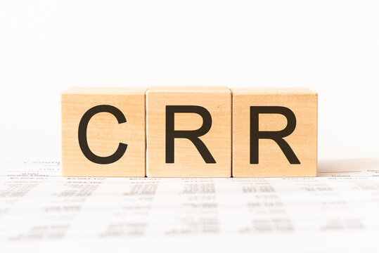 Word crr. Wooden small cubes with letters isolated on white background with copy space available