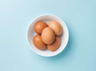 chicken eggs in a white bowl