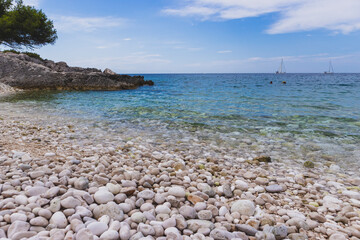 Fascinating blue Adriatic sea splashing white pebble 
