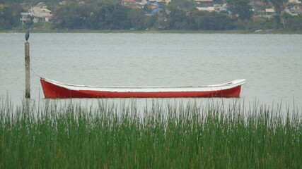 red canoe on lake
